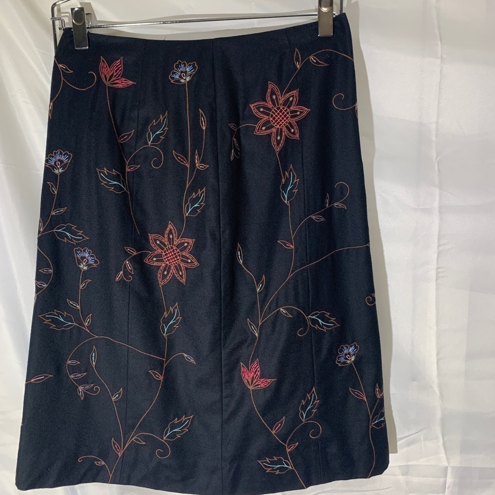 Harold’s black skirt with  flowers, print size 10